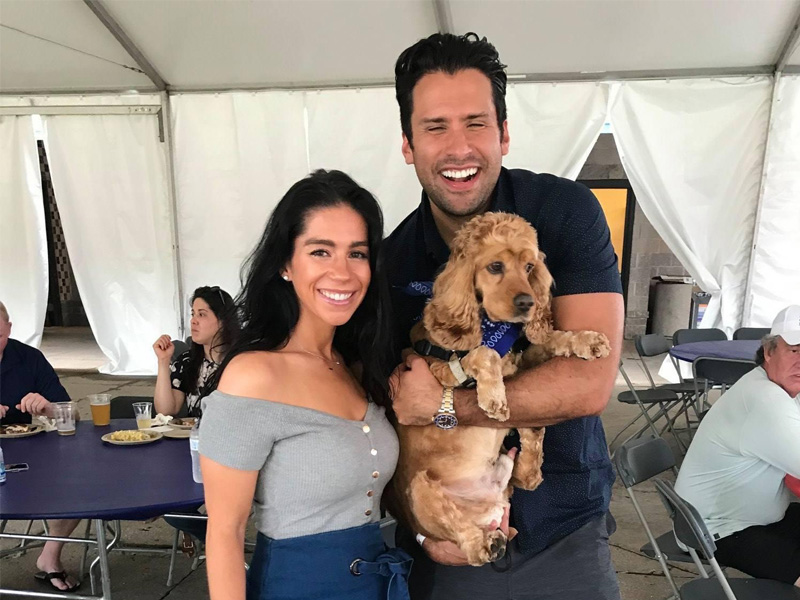Partner, Paul, with his wife, Keriann, and their dog, Nugget, enjoying the 2019 company barbeque.